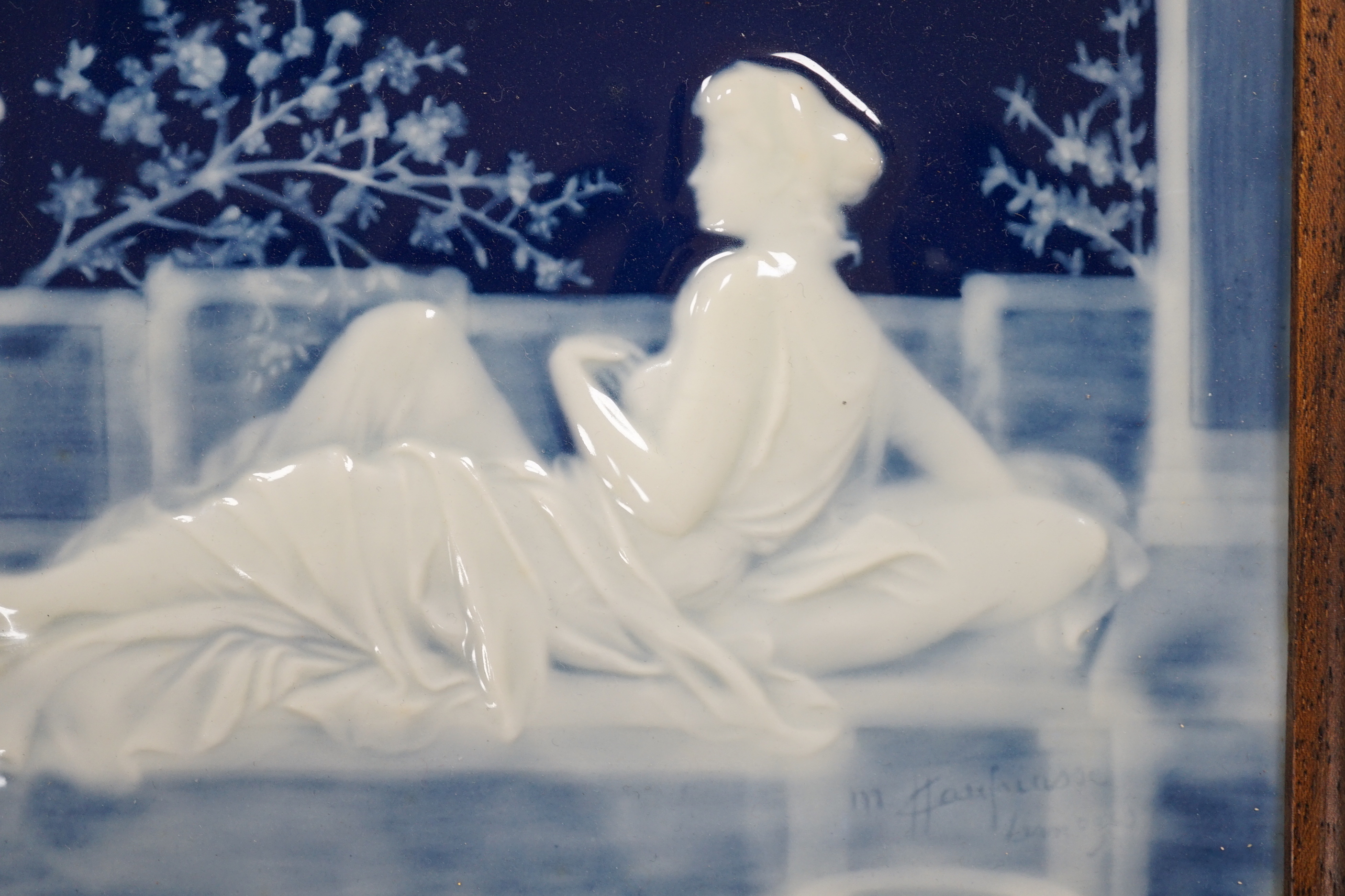 A framed pate sur pate panel, signed Chaufriase, recumbent female, Limoges, 20.5cm x 15cm